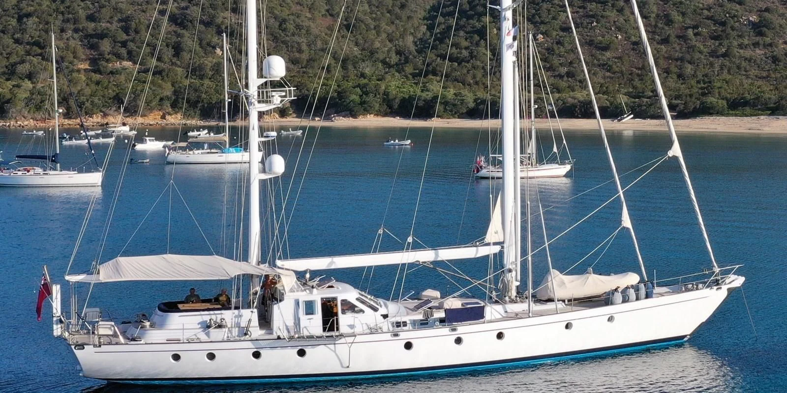 a boat with a sail on the water aboard ACOA Yacht for Sale