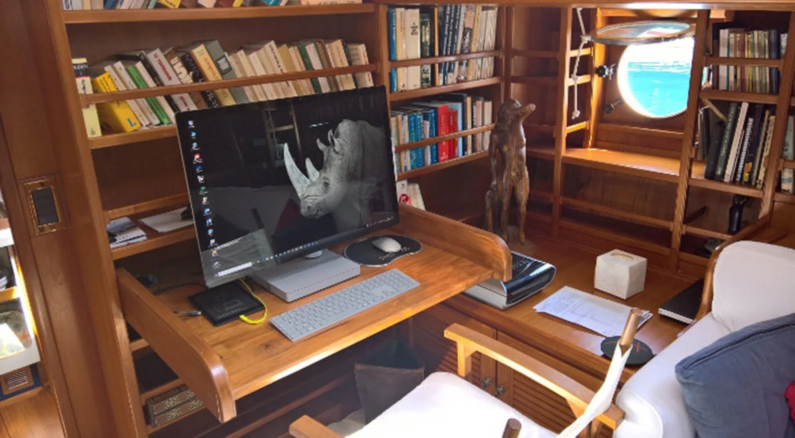 a computer on a desk aboard ACOA Yacht for Sale