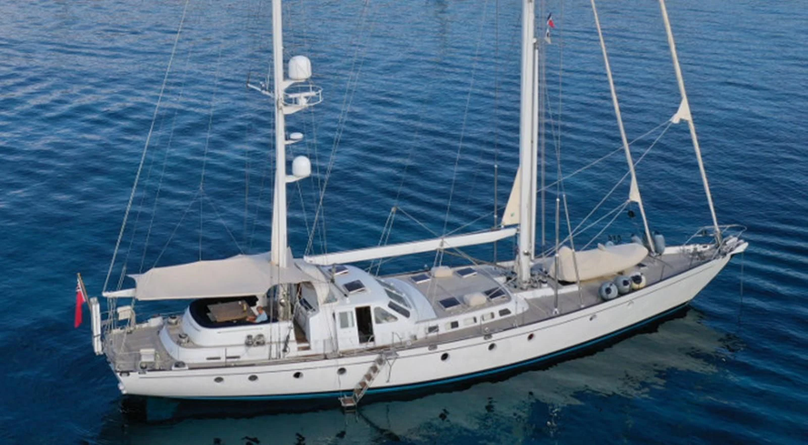 a white boat in the water aboard ACOA Yacht for Sale