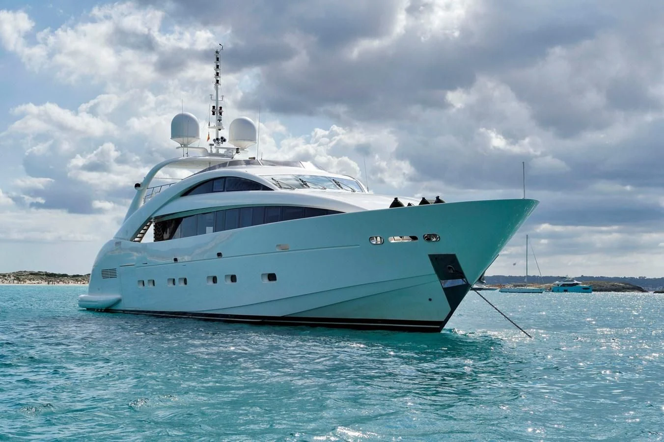 a white boat in the water aboard WHISPERING ANGEL Yacht for Sale
