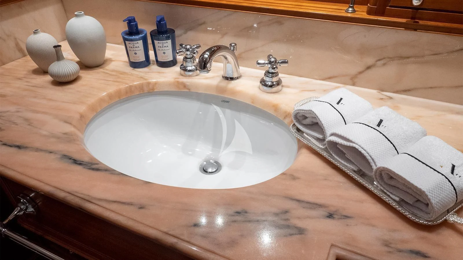 a sink with a towel and a towel on it aboard ALMYRA II Yacht for Charter