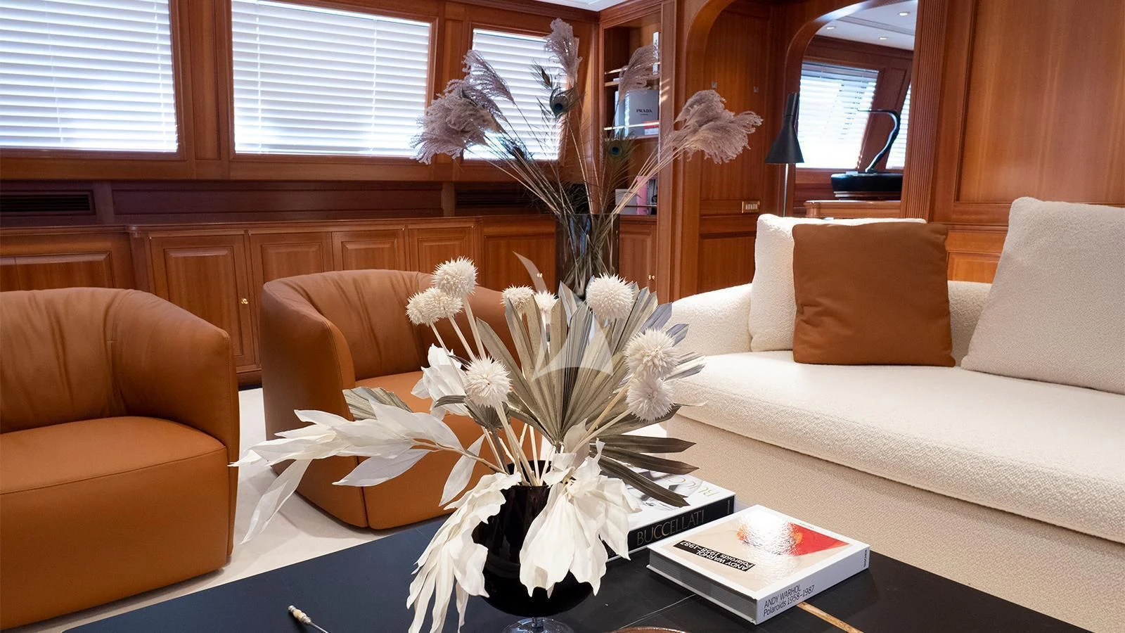 a vase of flowers on a table aboard ALMYRA II Yacht for Charter