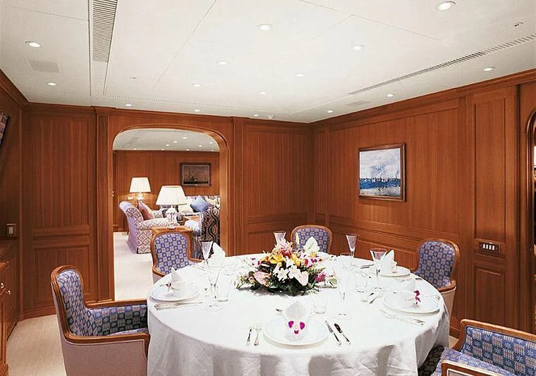 a dining table set for a formal dinner aboard ALMYRA II Yacht for Charter