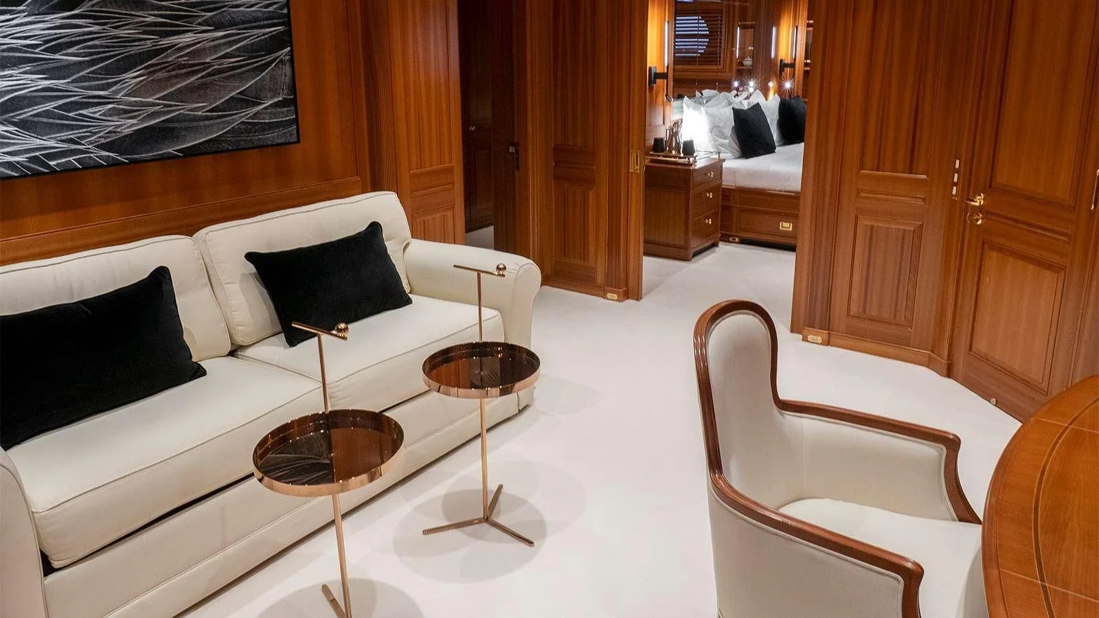 a room with a bed and a chair aboard ALMYRA II Yacht for Charter