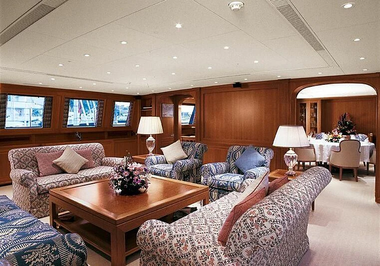 a living room with a couch and a table aboard ALMYRA II Yacht for Charter
