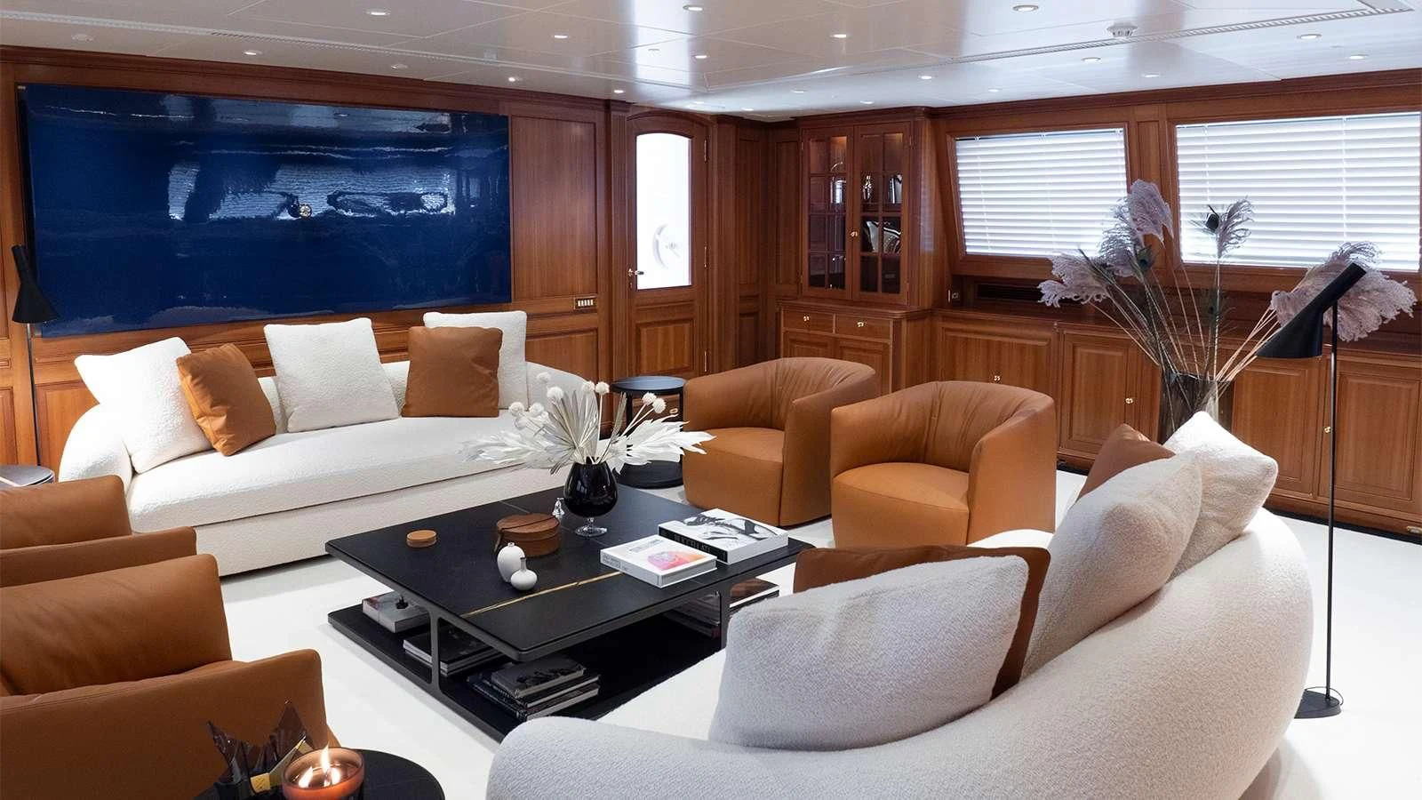 a living room with a couch and a coffee table aboard ALMYRA II Yacht for Charter