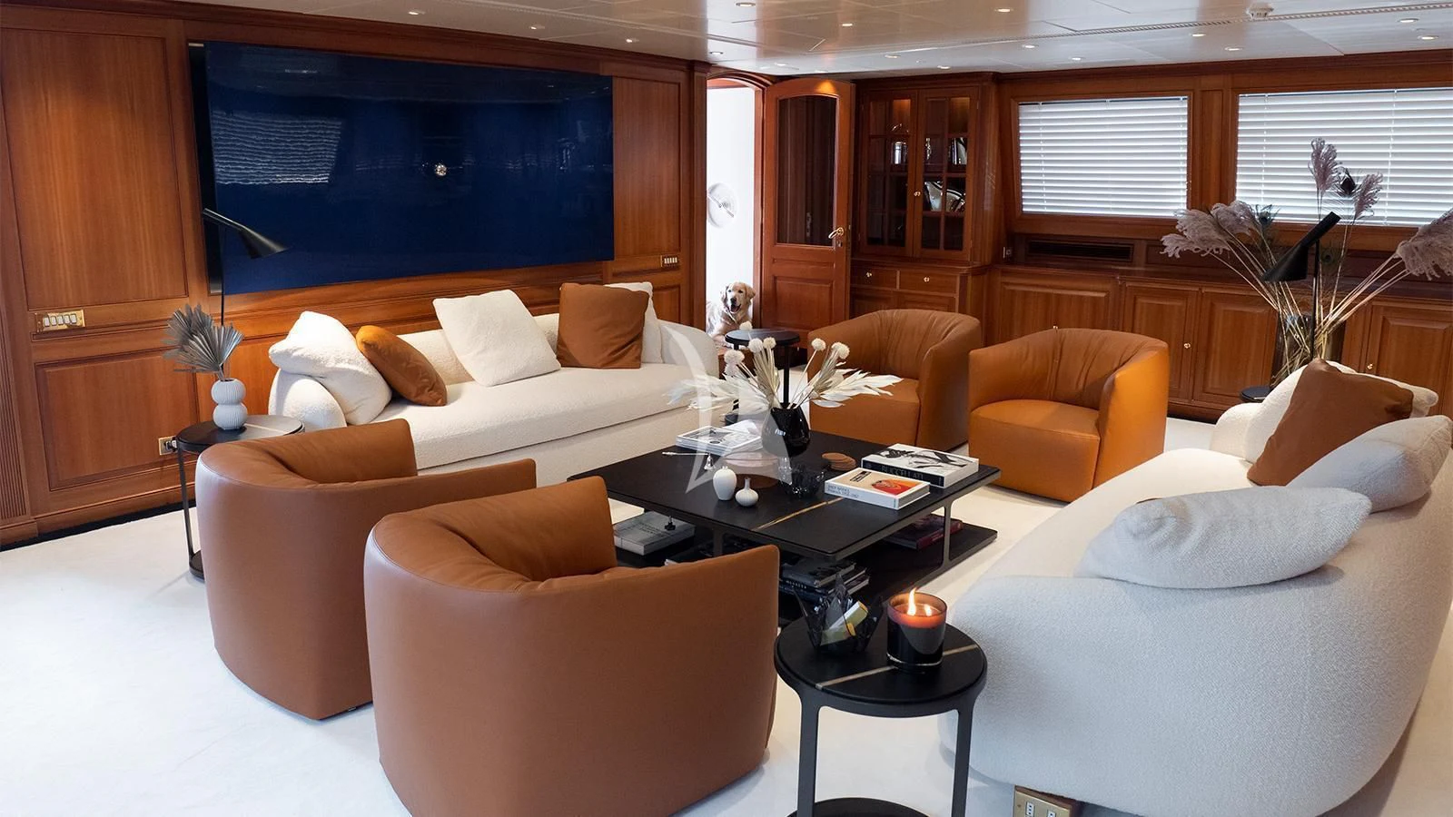 a living room with a couch and a coffee table aboard ALMYRA II Yacht for Charter