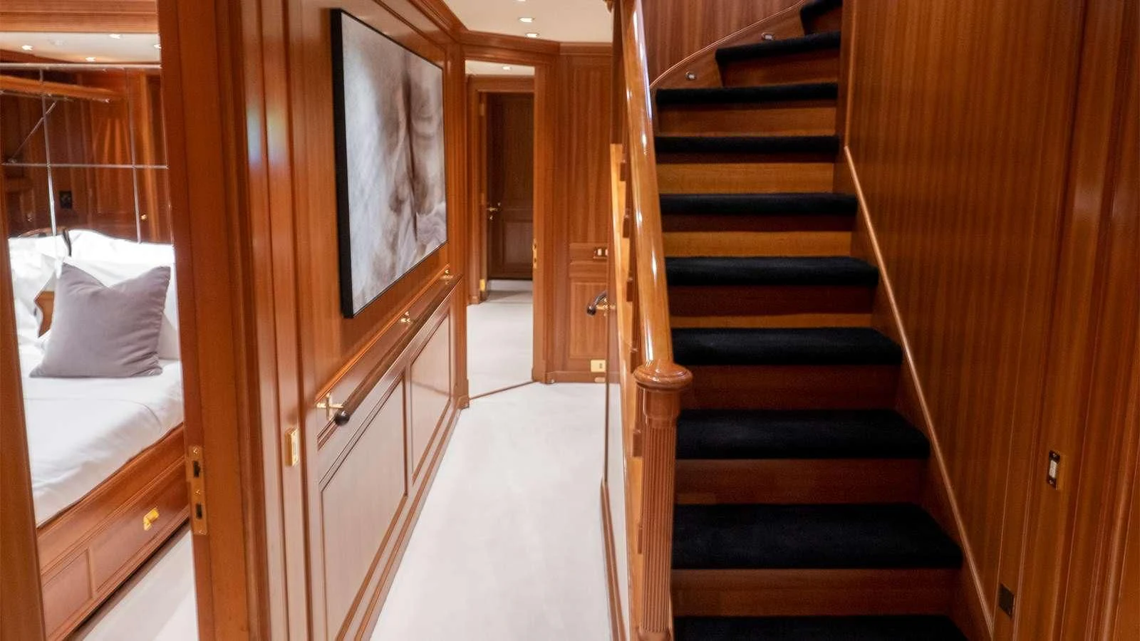 a room with a bed and a closet aboard ALMYRA II Yacht for Charter