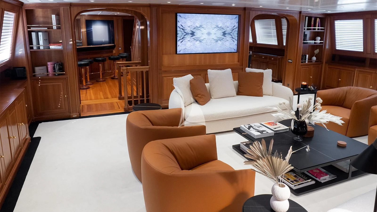 a living room with a white couch and a coffee table aboard ALMYRA II Yacht for Charter