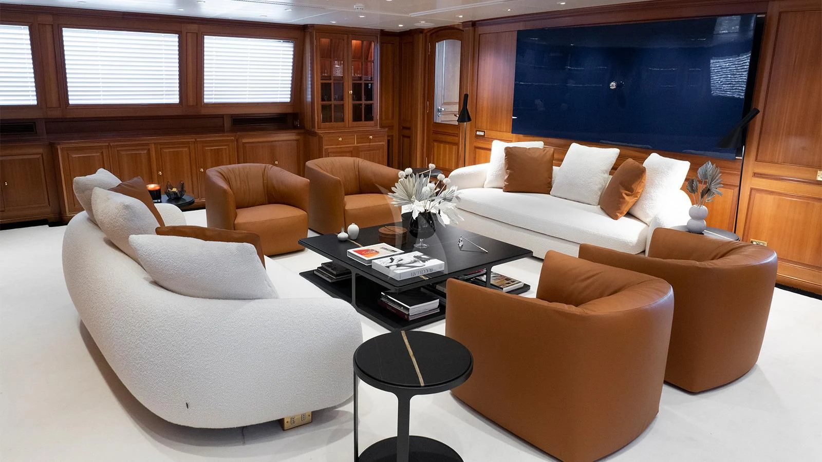 a living room with a white couch and a coffee table aboard ALMYRA II Yacht for Charter