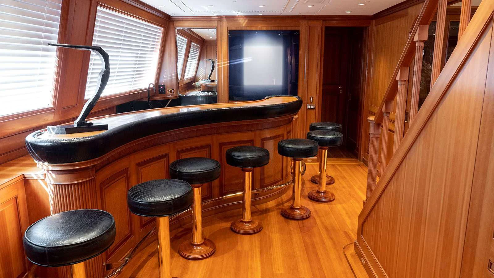 a kitchen with stools and stools aboard ALMYRA II Yacht for Charter
