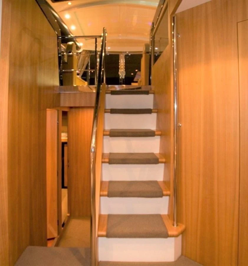a set of stairs in a building aboard BON VIVANT Yacht for Sale
