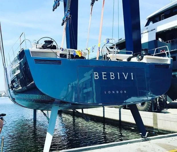 a blue and white boat aboard BEBIVI Yacht for Sale