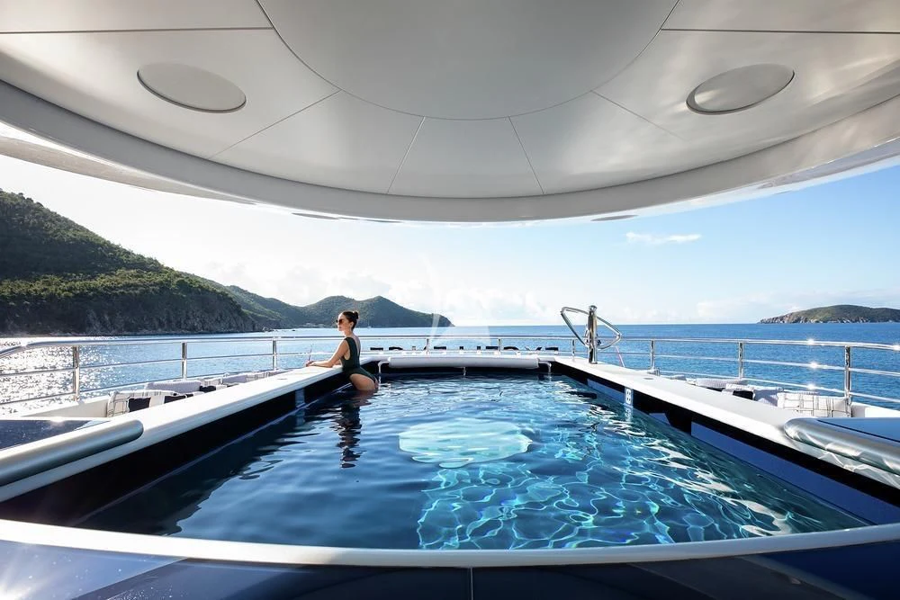 a person sitting in a pool aboard EXCELLENCE Yacht for Sale