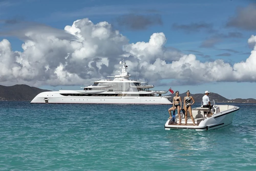 a group of people on a boat in the water aboard EXCELLENCE Yacht for Sale