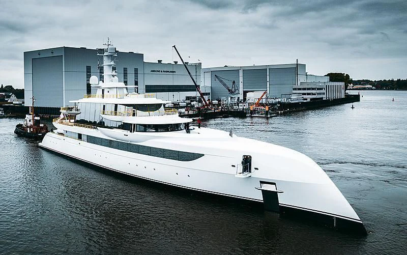 a large white boat in a body of water aboard EXCELLENCE Yacht for Sale