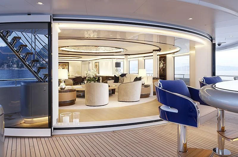 a room with a table chairs and a large window aboard EXCELLENCE Yacht for Sale