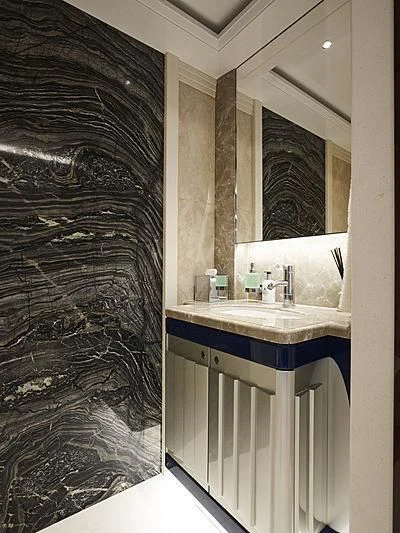 a bathroom with a sink and a shower curtain aboard EXCELLENCE Yacht for Sale