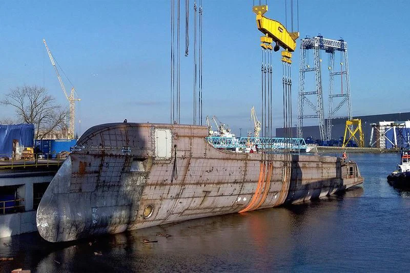 a large ship in a harbor aboard EXCELLENCE Yacht for Sale