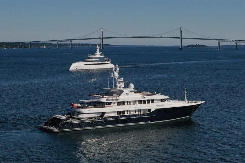 a large ship sailing in the water aboard EXCELLENCE Yacht for Sale