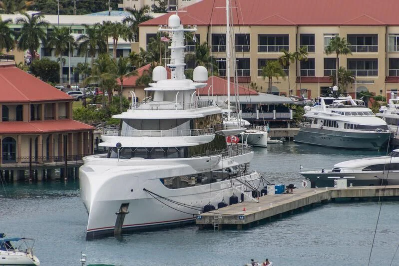 a group of boats are parked in a harbor aboard EXCELLENCE Yacht for Sale