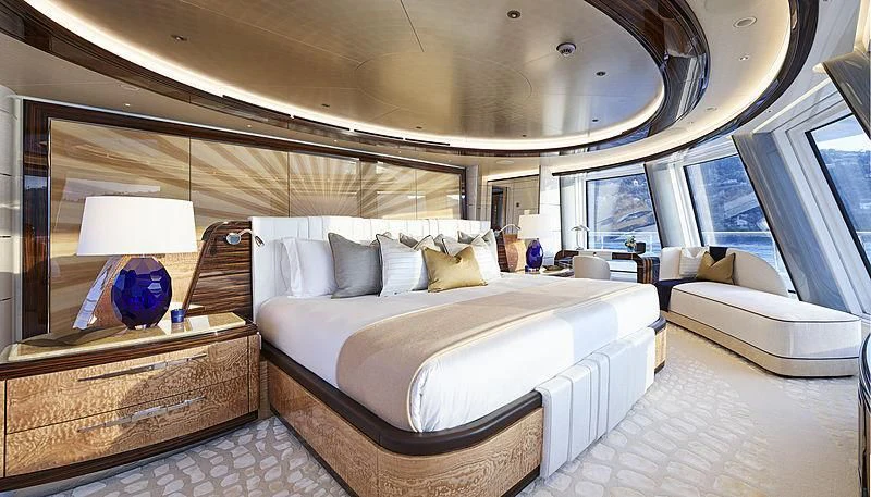 a large bed in a room aboard EXCELLENCE Yacht for Sale
