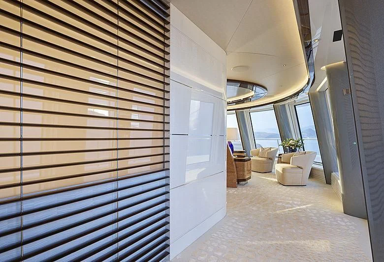 a room with a window and a chair aboard EXCELLENCE Yacht for Sale