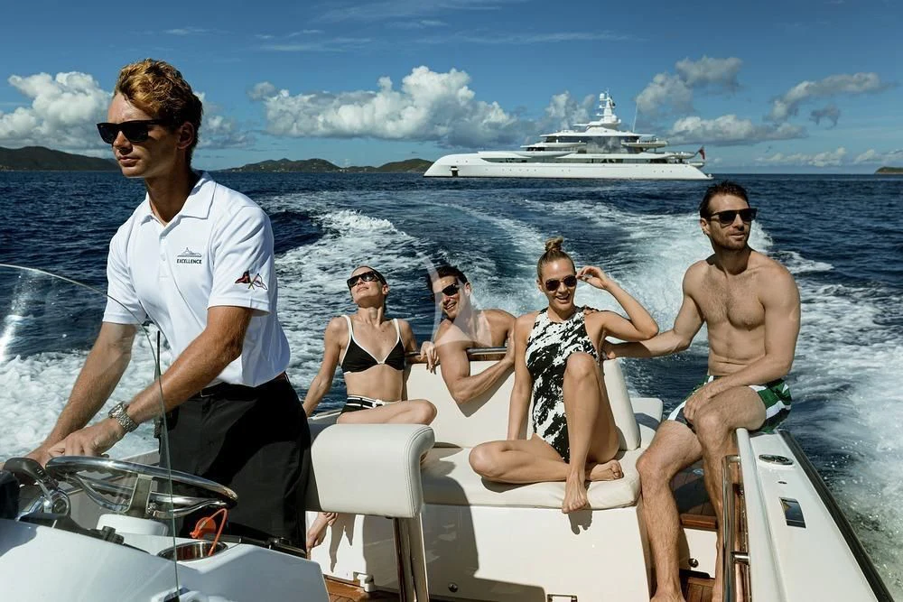 a group of people on a boat aboard EXCELLENCE Yacht for Sale