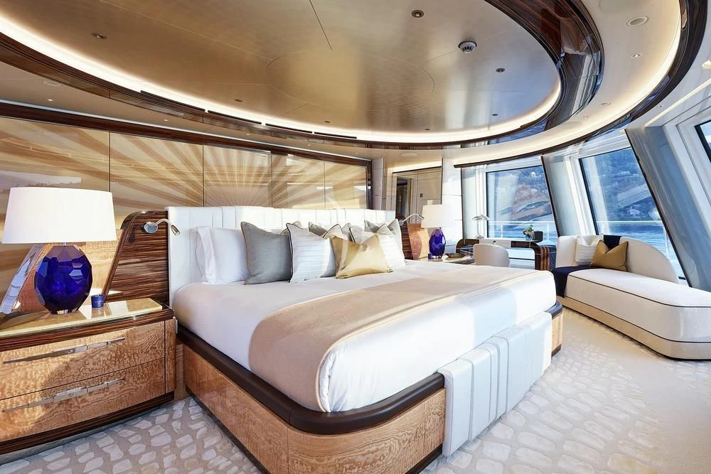 a large bed in a room aboard EXCELLENCE Yacht for Sale