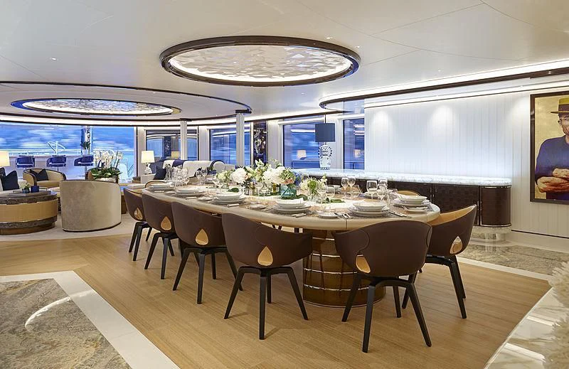 a table with chairs around it aboard EXCELLENCE Yacht for Sale