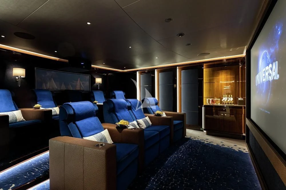 a living room with a couch and a tv aboard EXCELLENCE Yacht for Sale