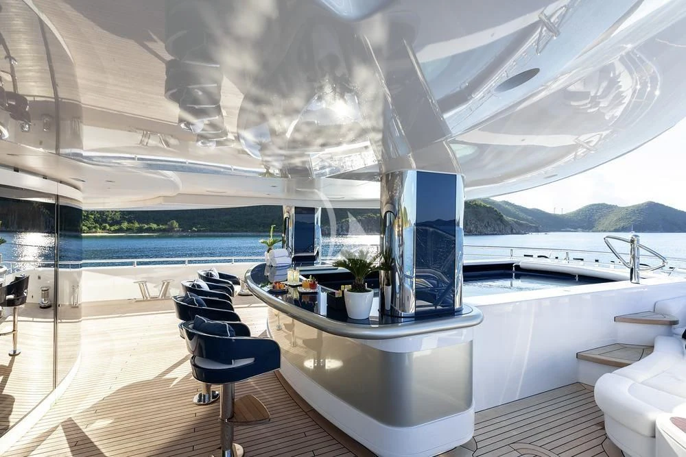 a room with a large white table and chairs and a large window aboard EXCELLENCE Yacht for Sale