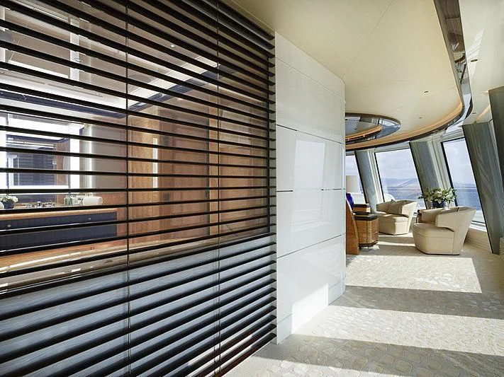 a room with a staircase and a window aboard EXCELLENCE Yacht for Sale