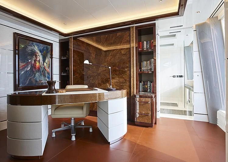 a room with a desk and a chair aboard EXCELLENCE Yacht for Sale