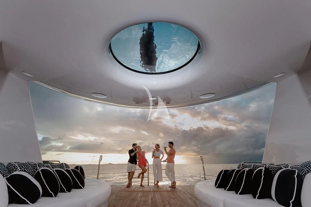 a group of people walking in a tunnel aboard EXCELLENCE Yacht for Sale