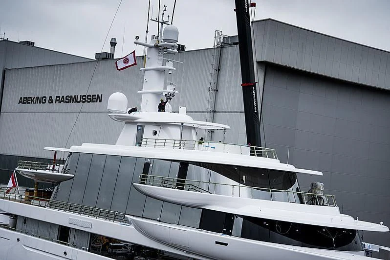 a boat docked in front of a building aboard EXCELLENCE Yacht for Sale