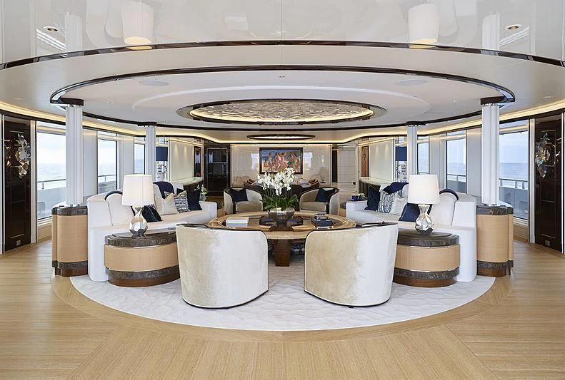 a large living room with a large chandelier aboard EXCELLENCE Yacht for Sale