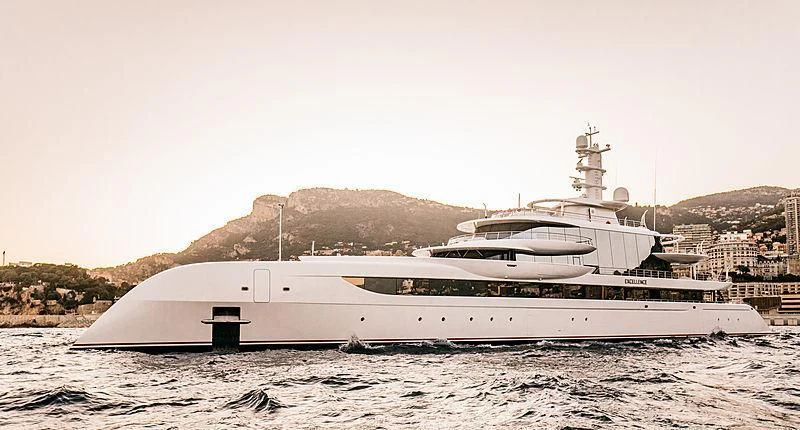 a large white boat on a beach aboard EXCELLENCE Yacht for Sale