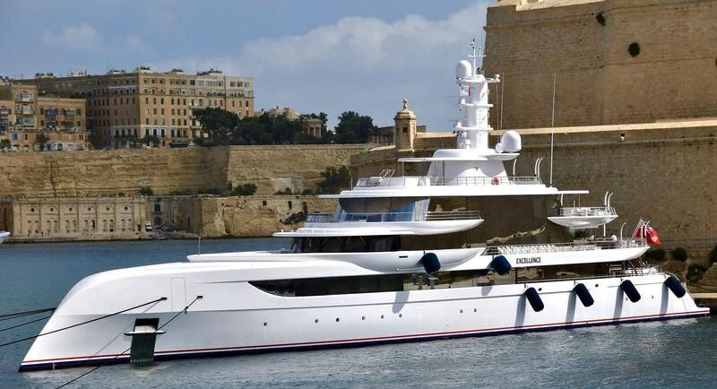 a boat parked on a dock aboard EXCELLENCE Yacht for Sale