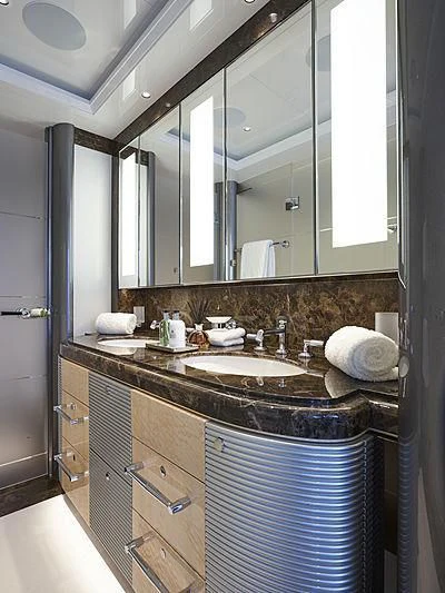 a bathroom with a large mirror aboard EXCELLENCE Yacht for Sale
