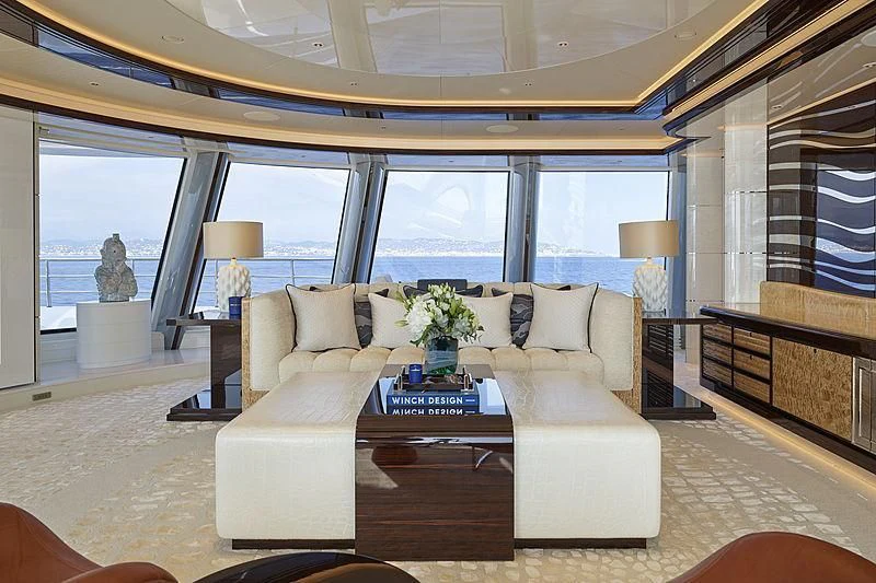 a living room with a large window aboard EXCELLENCE Yacht for Sale