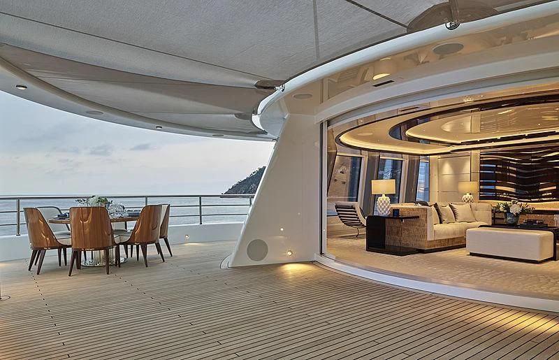 a room with a table and chairs aboard EXCELLENCE Yacht for Sale