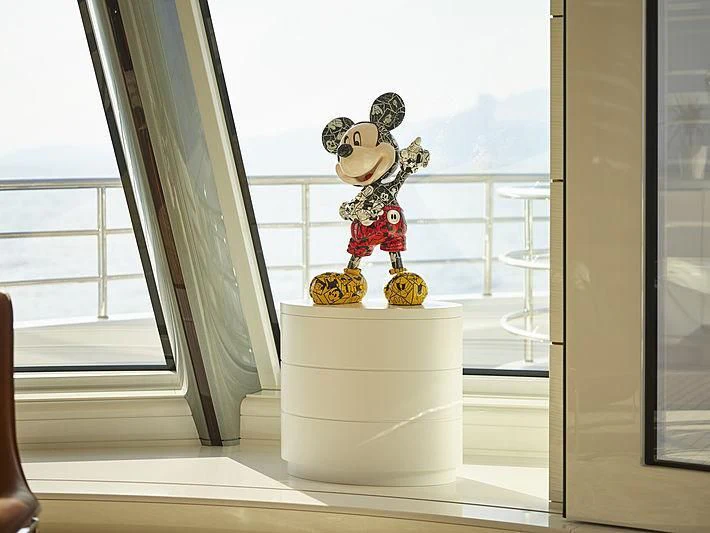 a small figurine on a white vase aboard EXCELLENCE Yacht for Sale