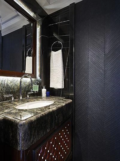 a bathroom with a sink and a mirror aboard EXCELLENCE Yacht for Sale