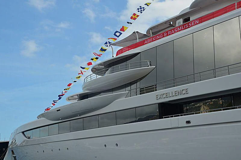 a large white boat with flags on it aboard EXCELLENCE Yacht for Sale