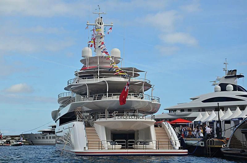 a large ship docked at a pier aboard EXCELLENCE Yacht for Sale