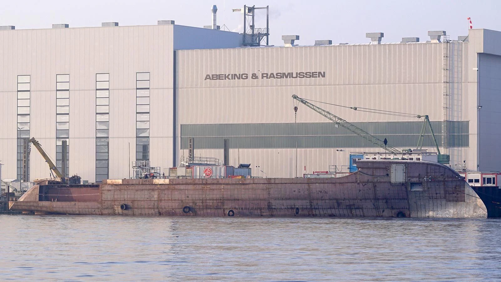 a large ship docked in front of a building aboard EXCELLENCE Yacht for Sale