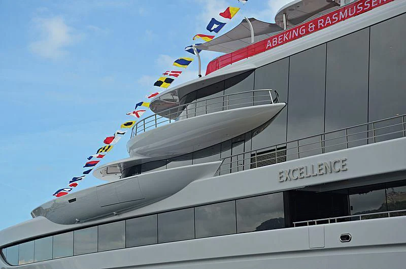 a large white boat with flags on it aboard EXCELLENCE Yacht for Sale