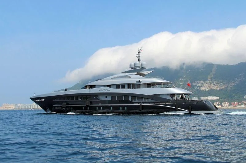 a large boat on the water aboard SILY Yacht for Sale