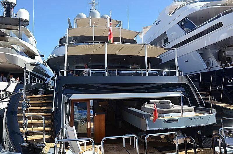 a boat with a deck and chairs aboard SILY Yacht for Sale
